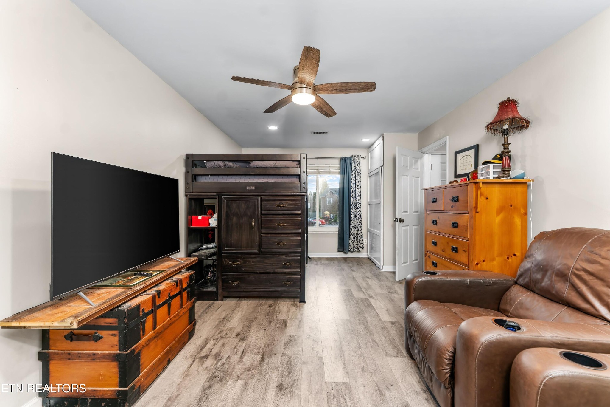 1935 Poplar Hill Road Knoxville, TN 37922 - Photo 8 of 25 a living room with furniture and a flat screen tv