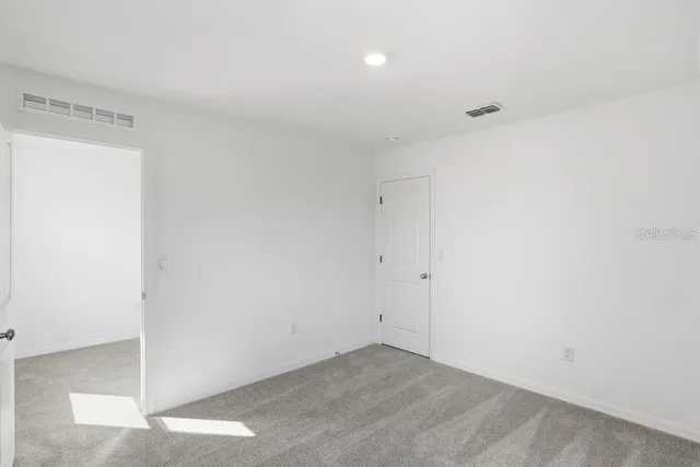 a bathroom with a bathtub and a toilet