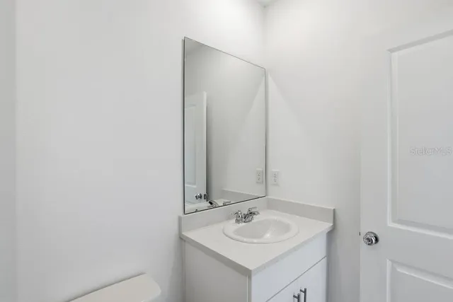 a view of an empty room and a window