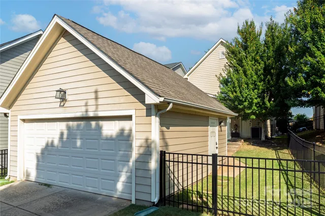 a view of a white house with a large window