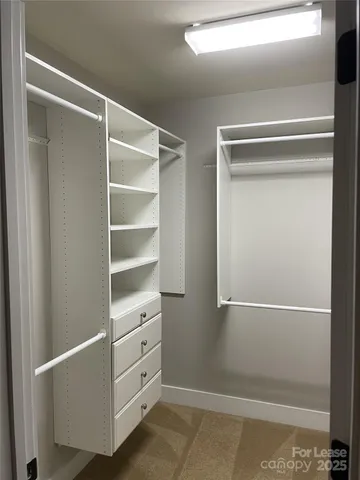 a view of an empty walk in closet