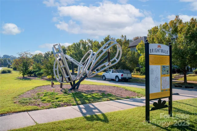 a swimming pool with lots of tress in front of it