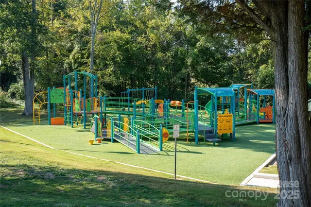 an aerial view of a swimming pool patio and outdoor seating
