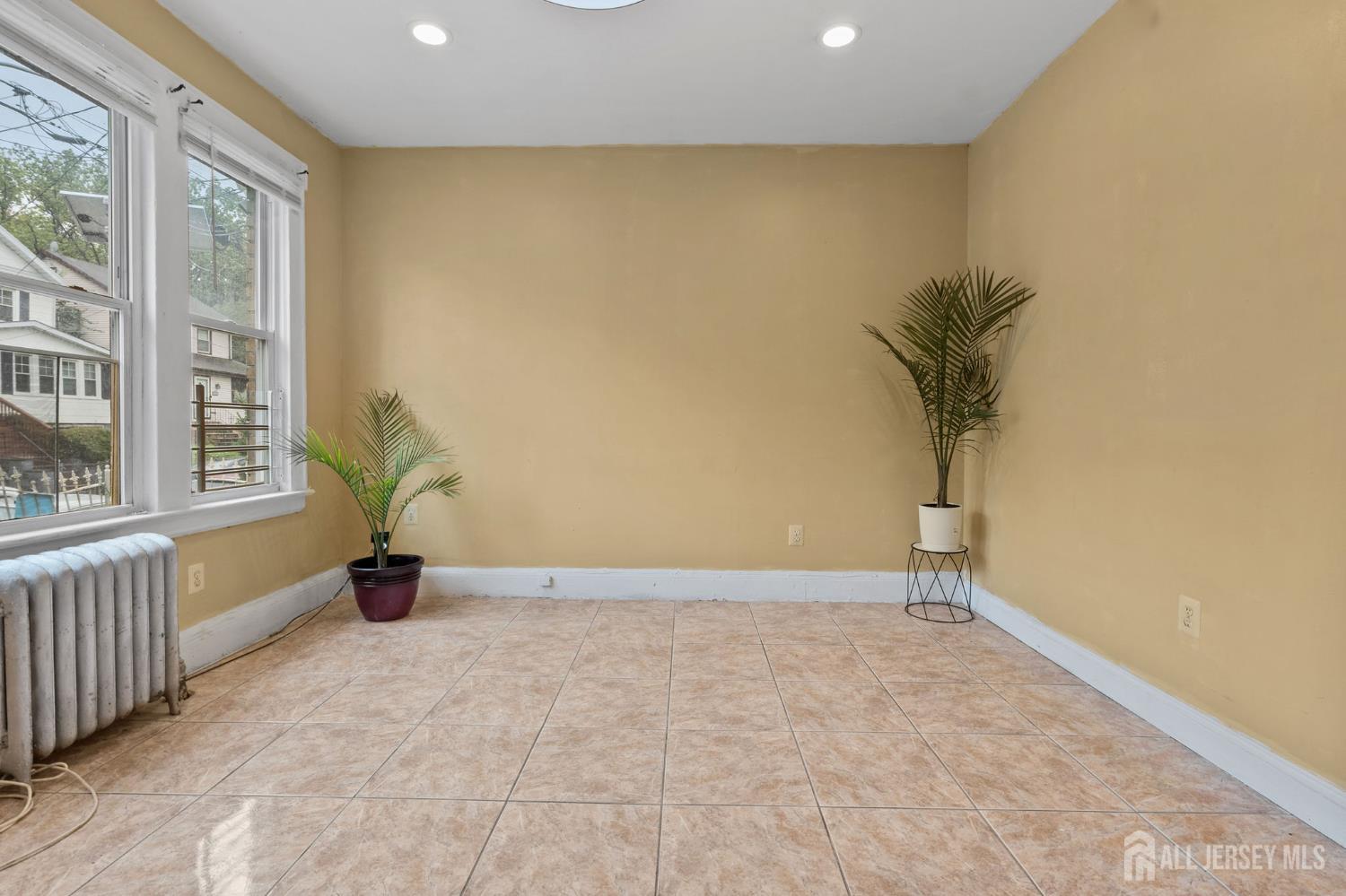 213 Maple Avenue, Unit 1 Irvington, NJ 07111 - Photo 4 of 17 a view of an empty room with a window