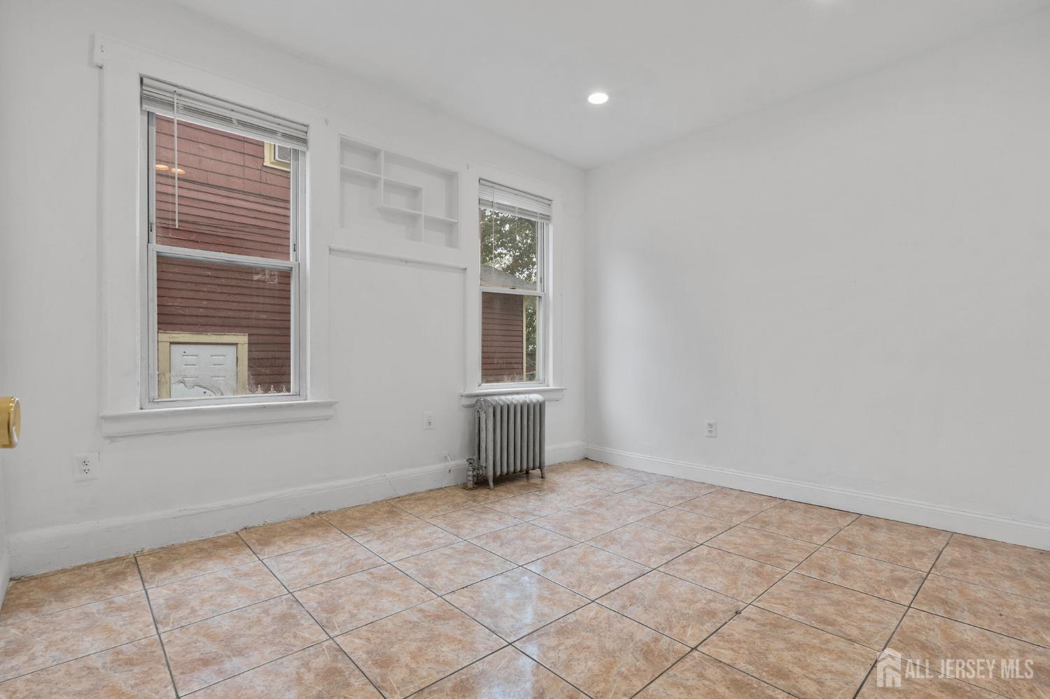 213 Maple Avenue, Unit 1 Irvington, NJ 07111 - Photo 8 of 17 a view of an empty room with a window