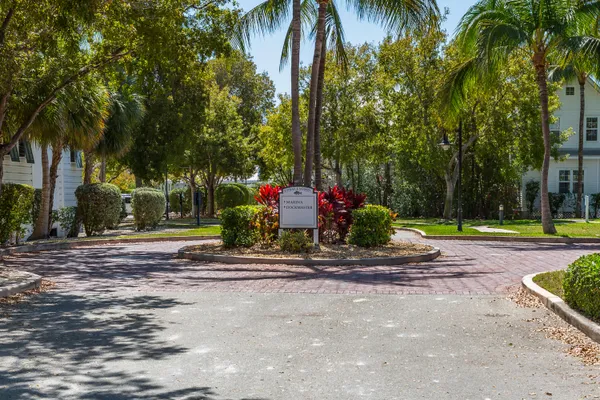 a view of a swimming pool with a table and chairs