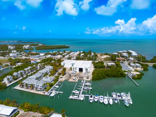 a view of a patio with table and chairs
