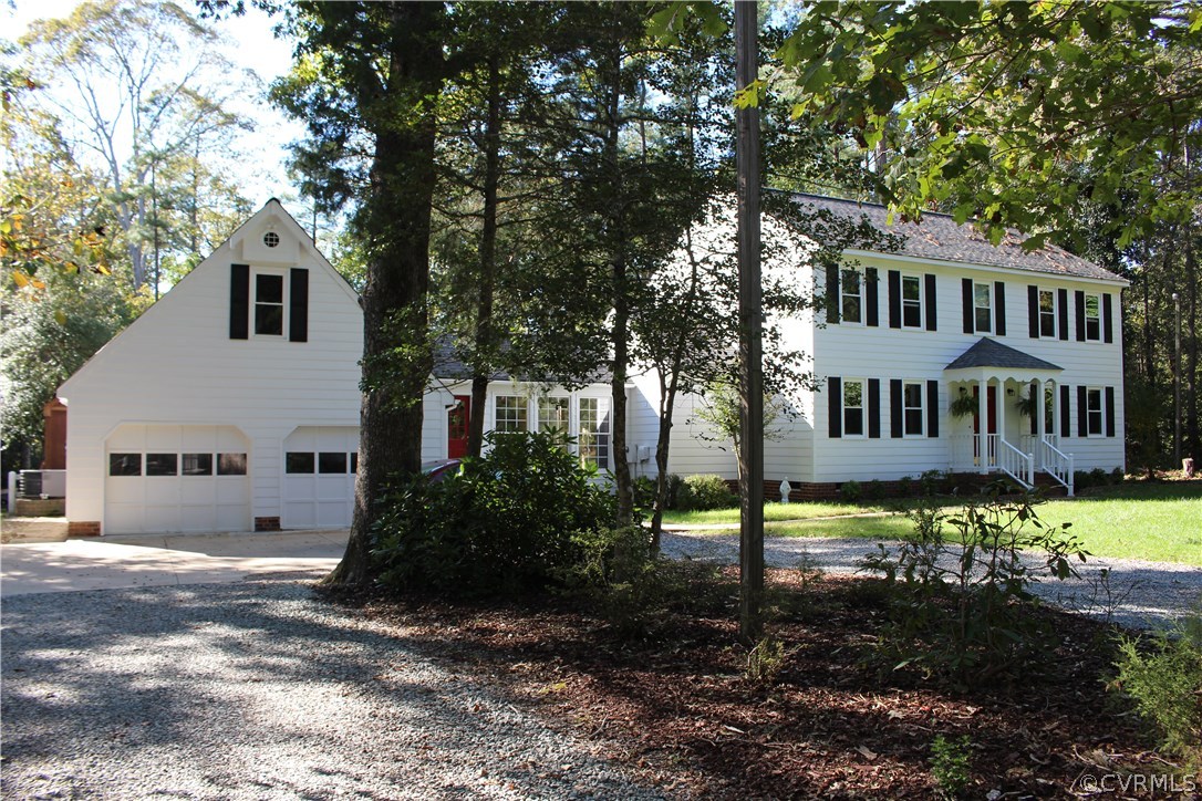 12236 Riverway Road Chesterfield, VA 23838 - Photo 3 of 44 a front view of a house with garden