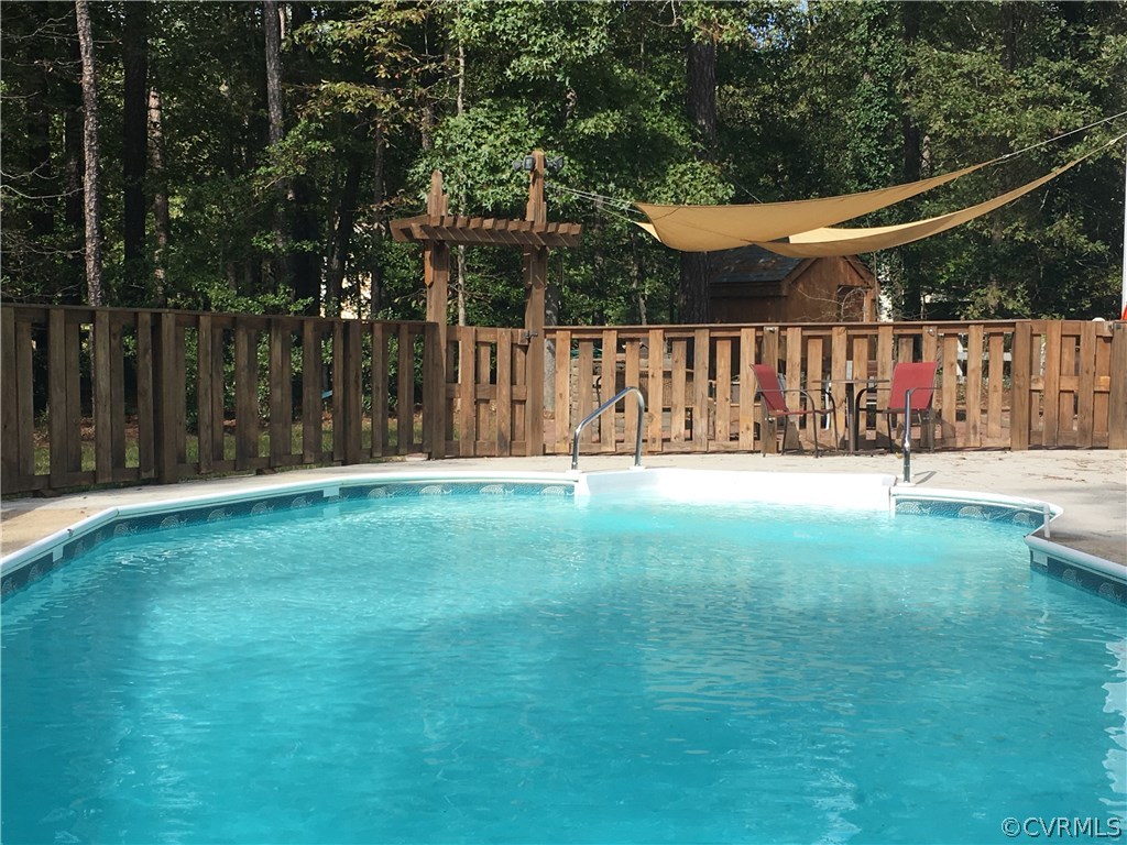 12236 Riverway Road Chesterfield, VA 23838 - Photo 36 of 44 a backyard of a house with lots of green space and trampoline