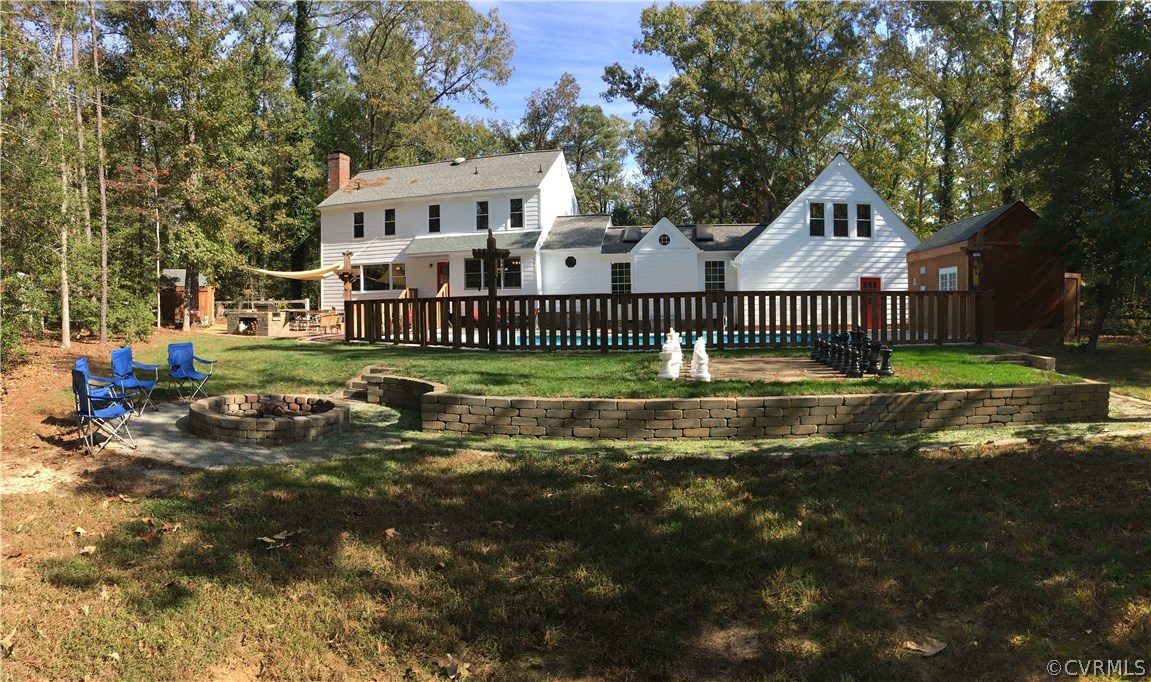 12236 Riverway Road Chesterfield, VA 23838 - Photo 42 of 44 a view of a big house with a big yard and large trees