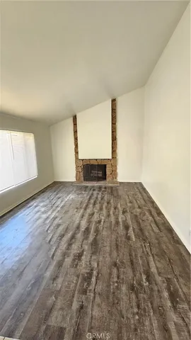 a view of a kitchen with microwave and cabinets