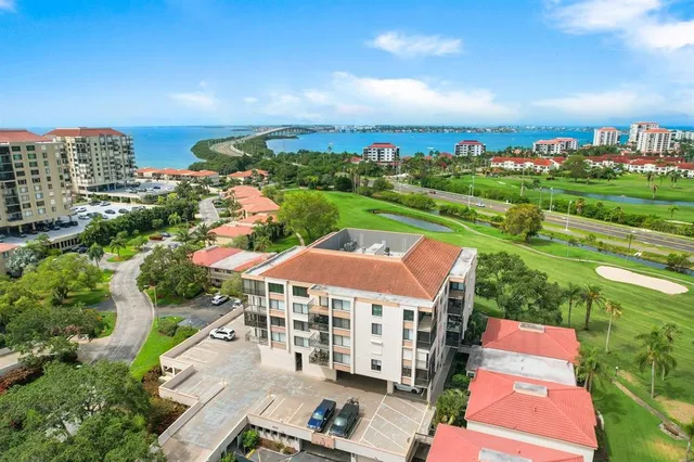 an aerial view of multiple houses with yard
