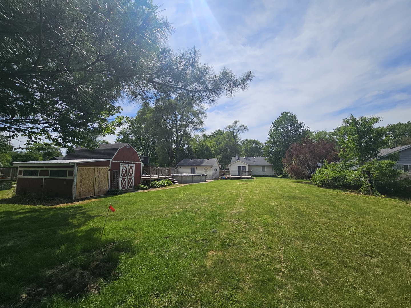 10N827 Hawthorne Street Elgin, IL 60123 - Photo 12 of 14 a backyard of a house with lots of green space