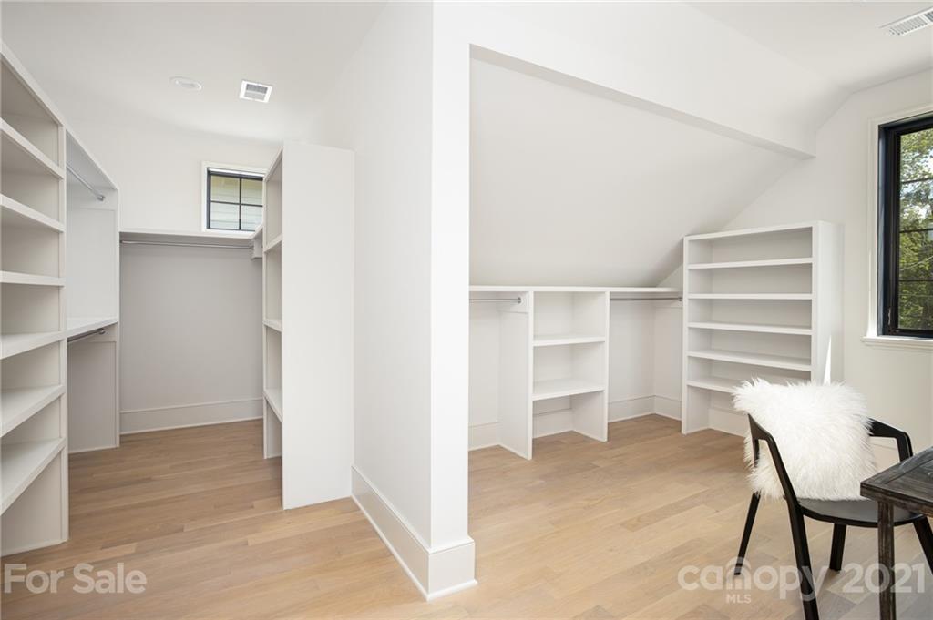 508 Westbury Road Charlotte, NC 28211 - Photo 24 of 48 a view of a room with wooden floor and windows in it