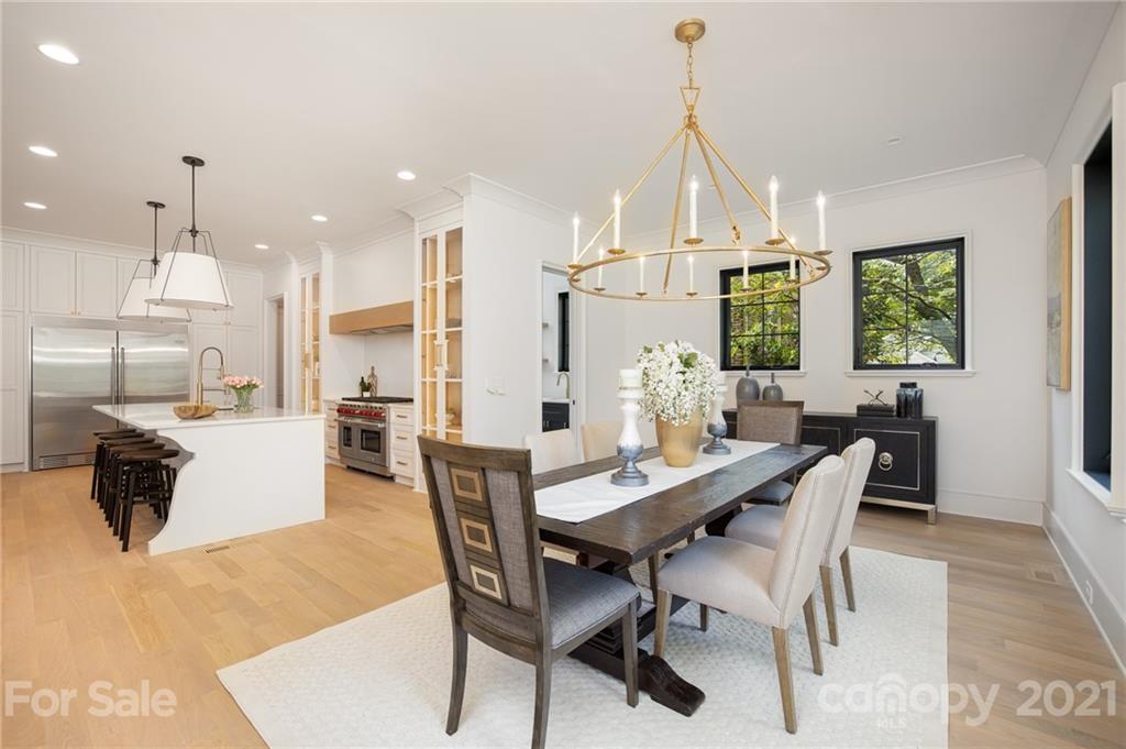 508 Westbury Road Charlotte, NC 28211 - Photo 34 of 48 a dining room with furniture and a chandelier