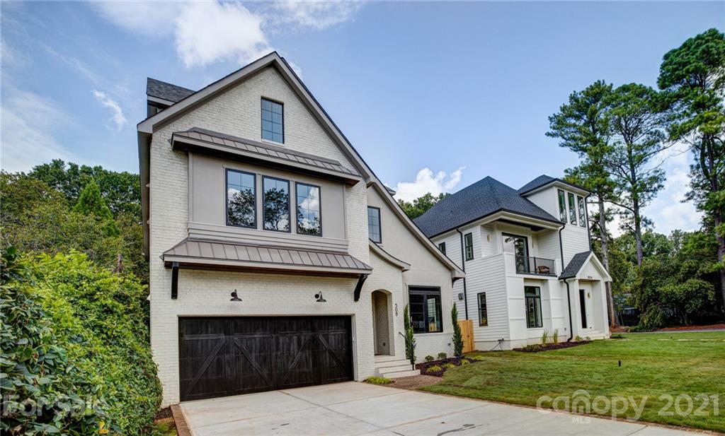 508 Westbury Road Charlotte, NC 28211 - Photo 43 of 48 a front view of a house with a garden