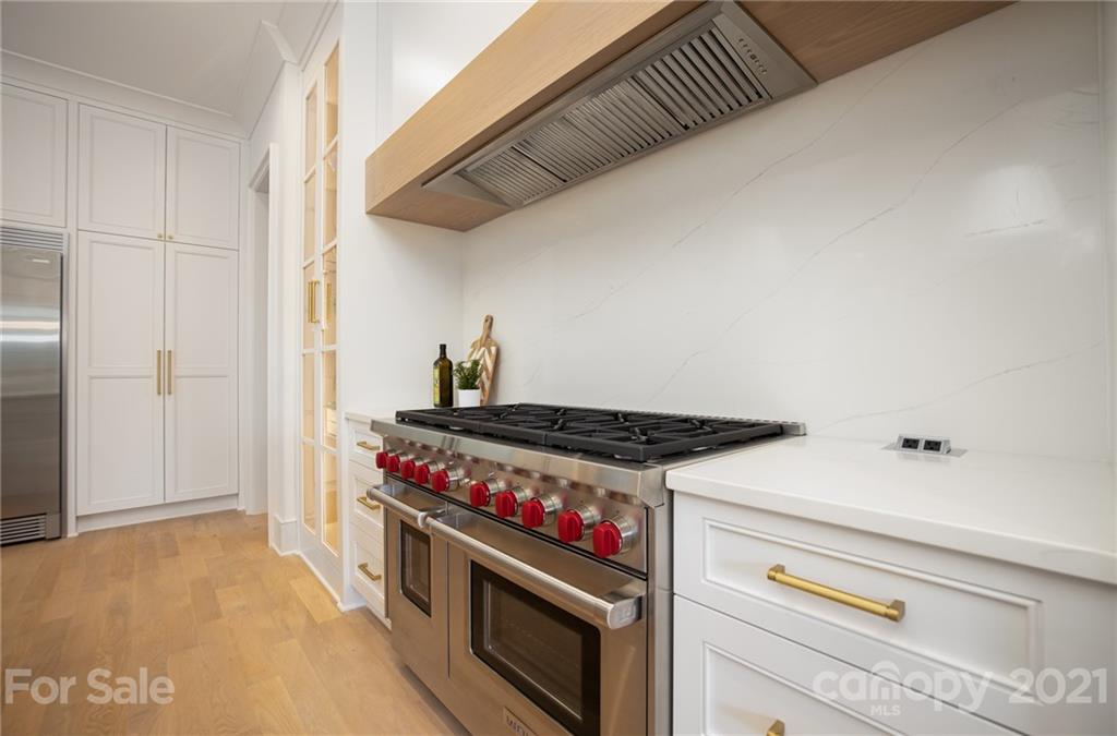 508 Westbury Road Charlotte, NC 28211 - Photo 9 of 48 a kitchen with a stove and a refrigerator