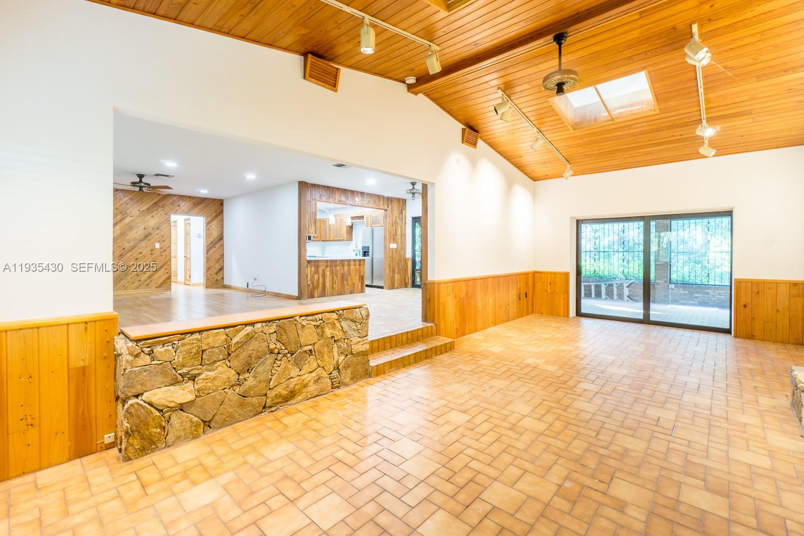 6290 Southwest 86th Street Miami, FL 33143 - Photo 8 of 13 Family Room with Vaulted Ceilings and Skylight