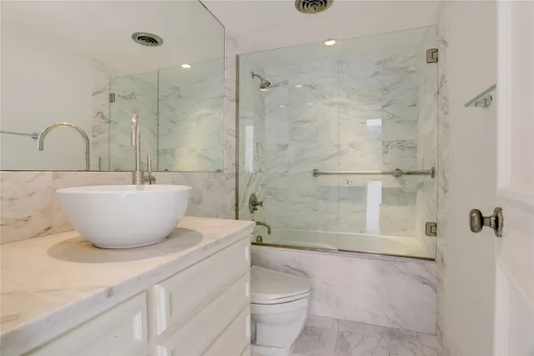 a bathroom with a bathtub and shower