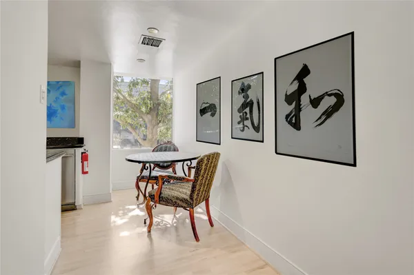 a dining room with furniture and window