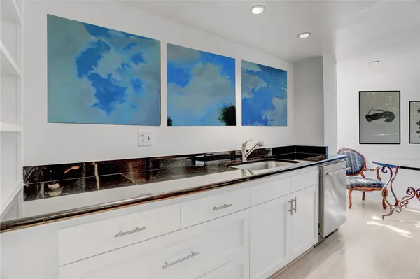 a kitchen with a sink and cabinets