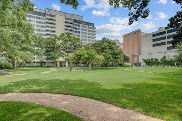 a view of a apartment with a yard