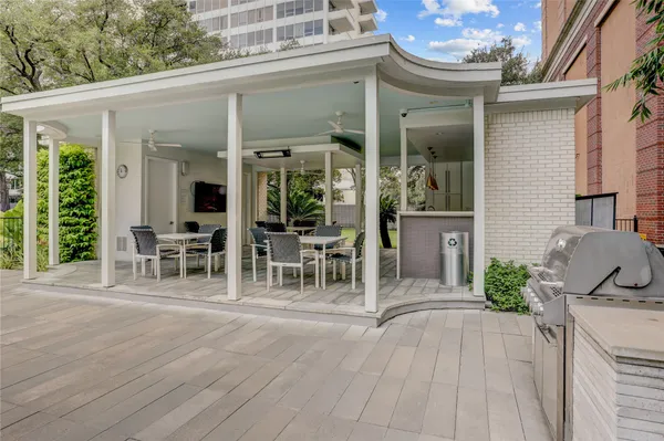 a front view of a house with patio outdoor seating and yard