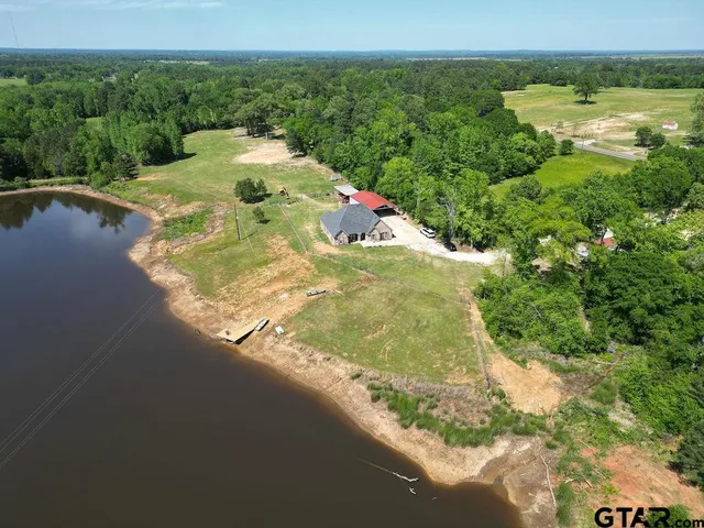 a view of a lake with a yard