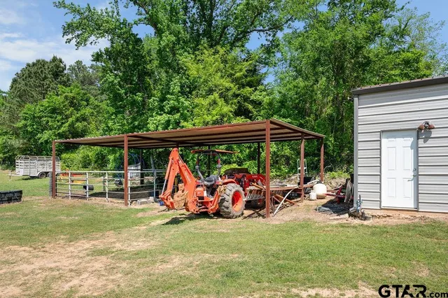 a view of a water fountain and a yard