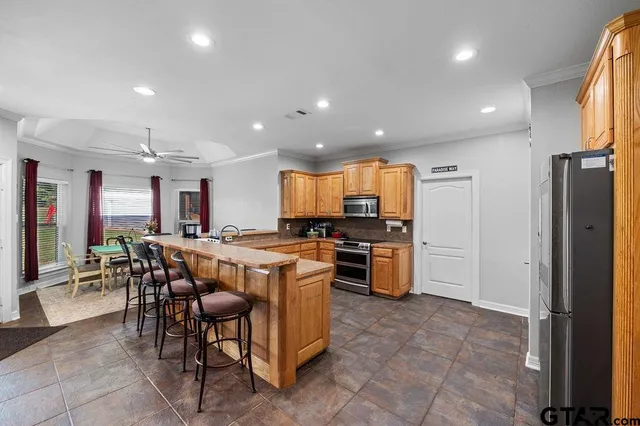 a dining room with furniture and window