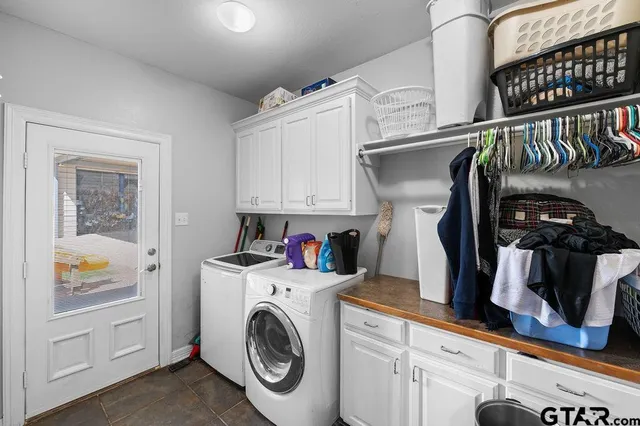 a bedroom with a bed wooden floor and window
