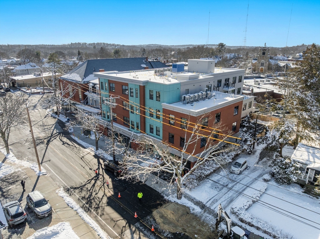 1151 Walnut Street, Unit 207 Newton, MA 02461 - Photo 16 of 27 an aerial view of a house with a yard