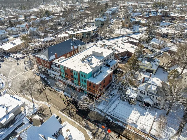 a kitchen with stainless steel appliances a refrigerator sink and cabinets