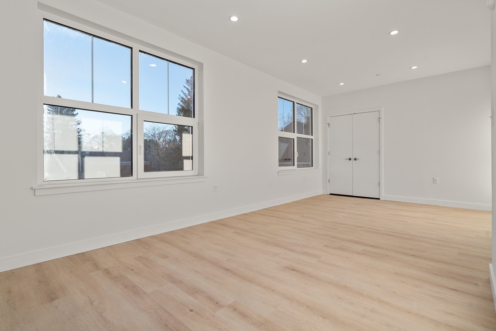 1151 Walnut Street, Unit 207 Newton, MA 02461 - Photo 25 of 27 a view of empty room with windows