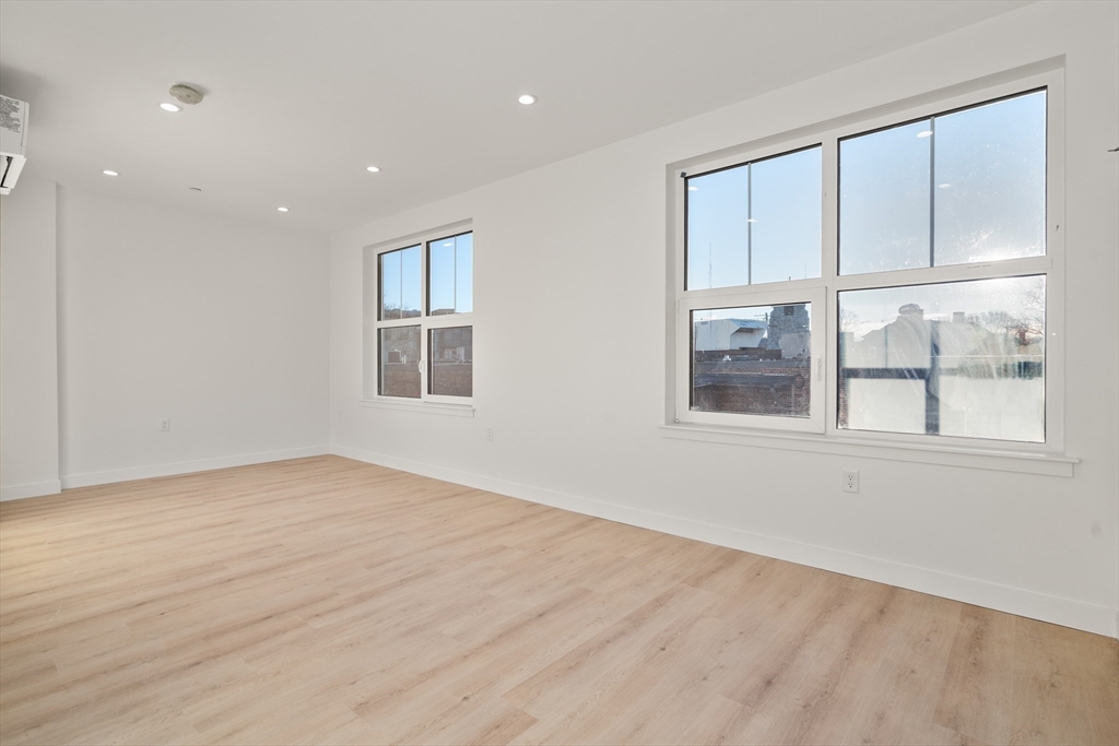 1151 Walnut Street, Unit 207 Newton, MA 02461 - Photo 26 of 27 a view of an empty room with a window