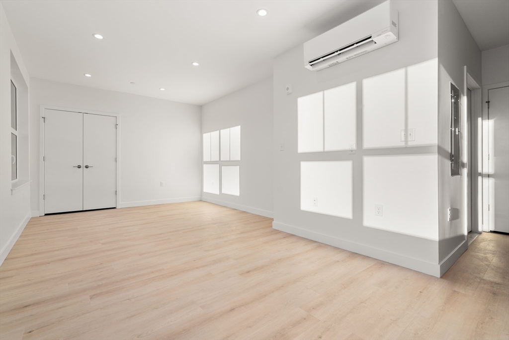 1151 Walnut Street, Unit 207 Newton, MA 02461 - Photo 27 of 27 a view of an empty room with a window