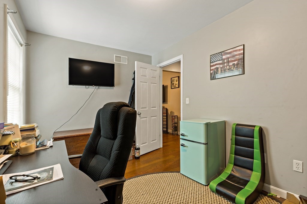 29 Florence Street Fall River, MA 02720 - Photo 16 of 34 a living room with furniture and a flat screen tv