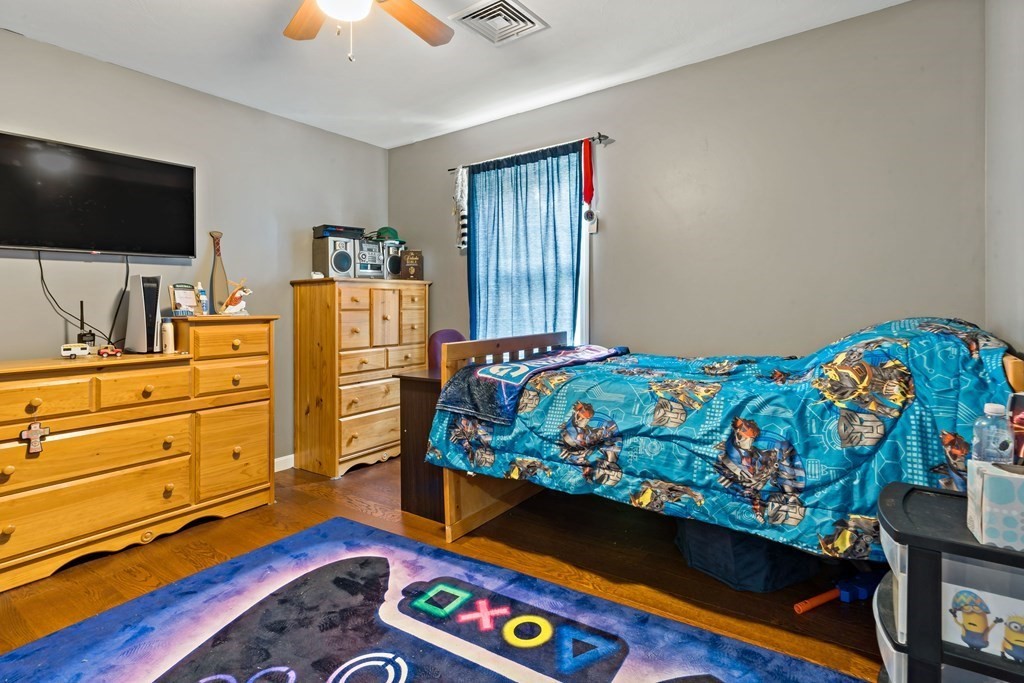 29 Florence Street Fall River, MA 02720 - Photo 20 of 34 a bedroom with a bed and flat screen tv