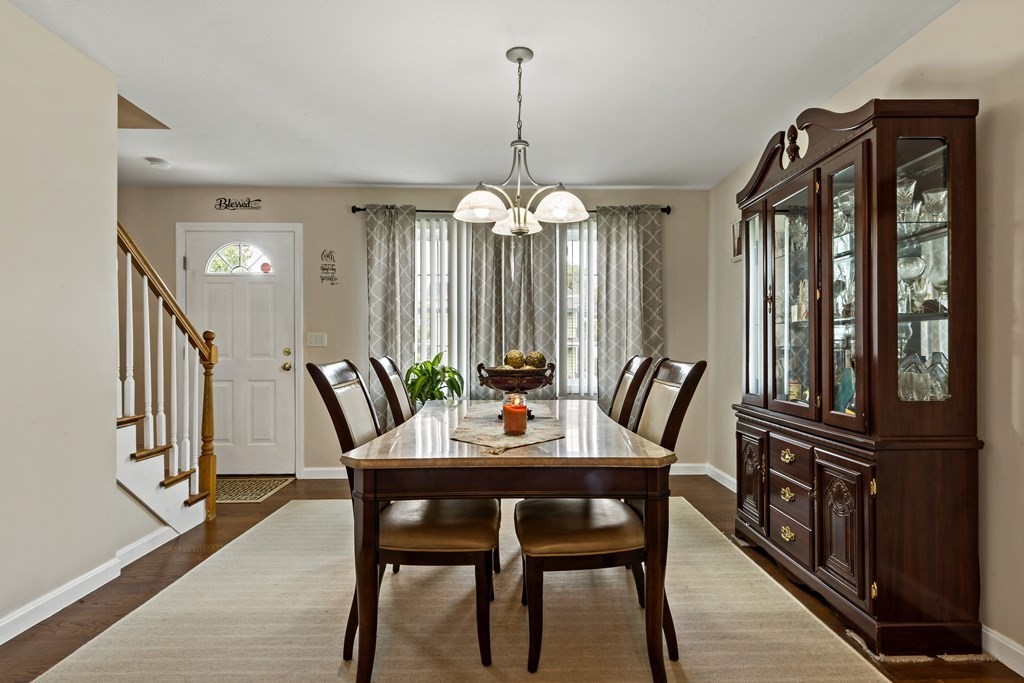 29 Florence Street Fall River, MA 02720 - Photo 2 of 34 a dining room with furniture a chandelier and wooden floor
