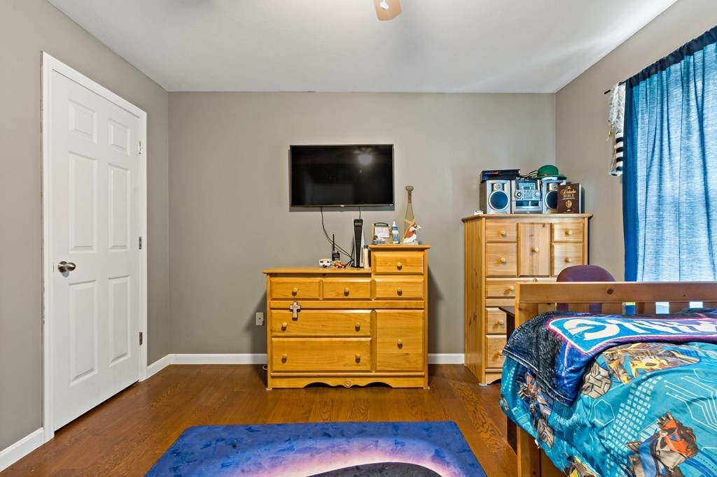 29 Florence Street Fall River, MA 02720 - Photo 21 of 34 a bedroom with a bed and flat screen tv