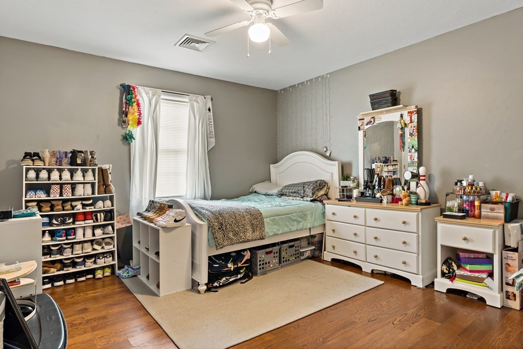 29 Florence Street Fall River, MA 02720 - Photo 23 of 34 a bedroom with a bed and a chandelier