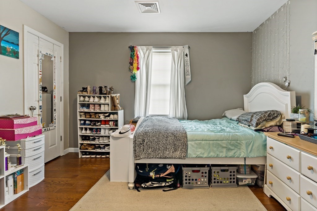 29 Florence Street Fall River, MA 02720 - Photo 24 of 34 a bedroom with a bed and a book shelf