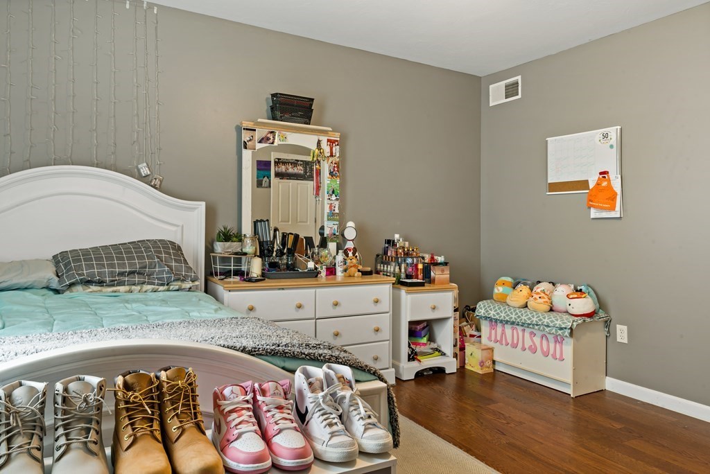 29 Florence Street Fall River, MA 02720 - Photo 25 of 34 a bedroom with furniture and a wooden floor