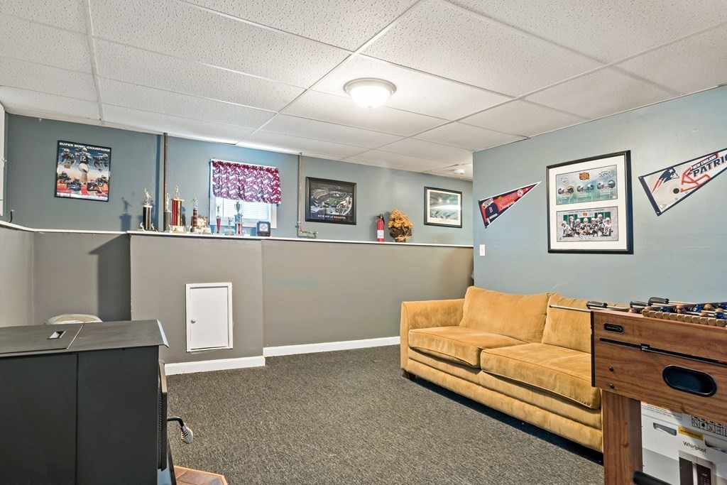29 Florence Street Fall River, MA 02720 - Photo 27 of 34 a living room with furniture and a flat screen tv