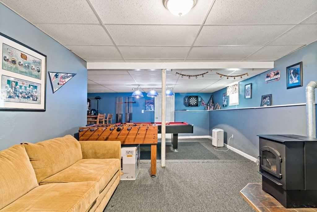 29 Florence Street Fall River, MA 02720 - Photo 28 of 34 a living room with furniture and a fireplace