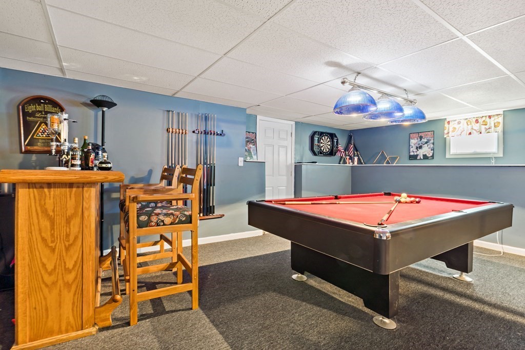 29 Florence Street Fall River, MA 02720 - Photo 29 of 34 a room with table chairs and a chandelier