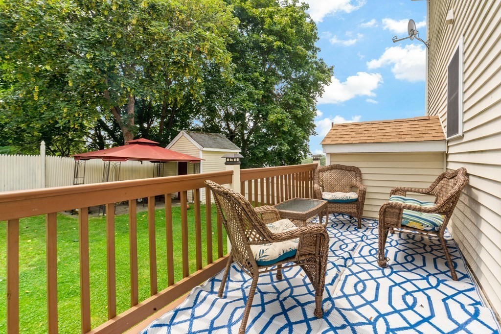 29 Florence Street Fall River, MA 02720 - Photo 31 of 34 a roof deck with chairs and wooden fence