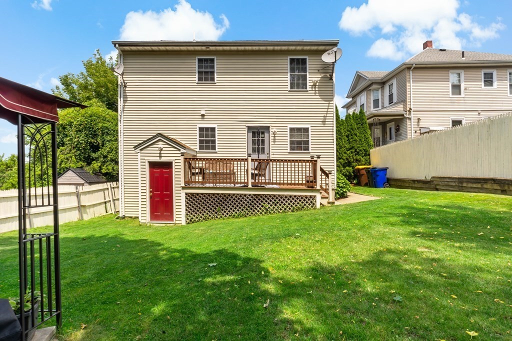 29 Florence Street Fall River, MA 02720 - Photo 33 of 34 a view of backyard with large garden and plants