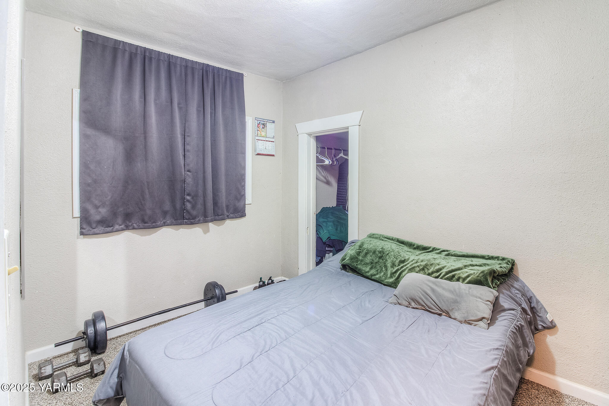 423 Wine Country Road Grandview, WA 98930 - Photo 11 of 14 a bedroom with a bed and a window