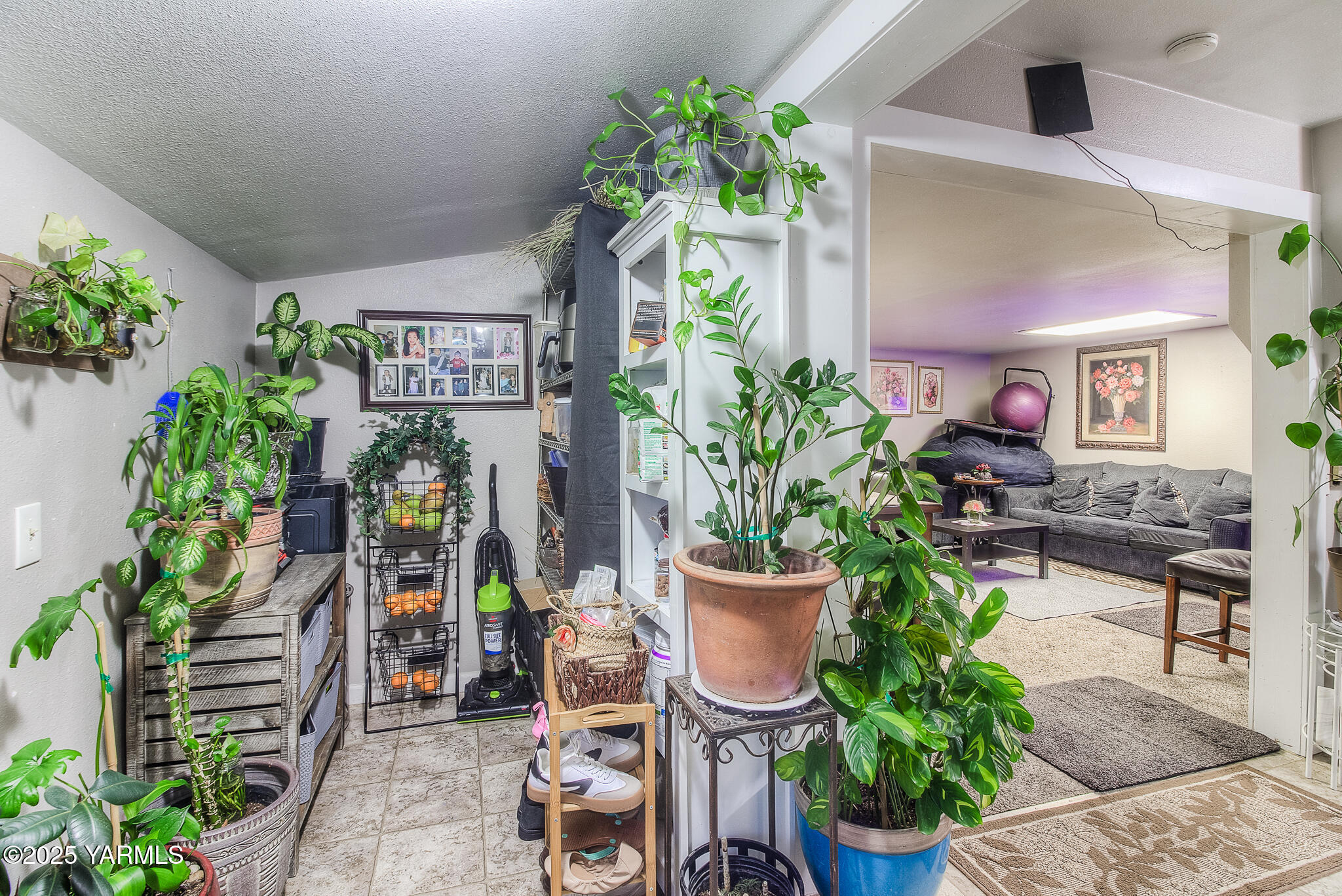 423 Wine Country Road Grandview, WA 98930 - Photo 13 of 14 a view of a porch with chairs and potted plants